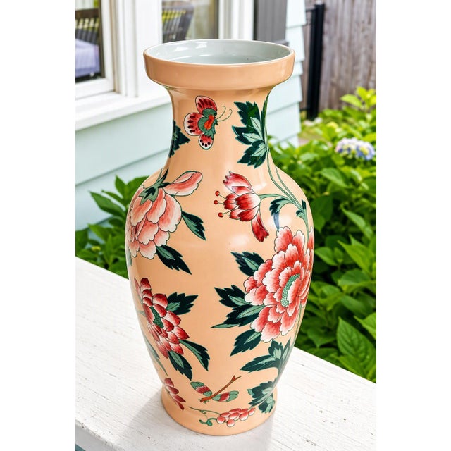 A very pretty porcelain vase decorated with hand painted chrysanthemums, butterflies and dragon fly. Convertible to lamp....