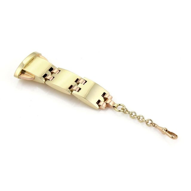This retro pocket watch fob is a beautiful vintage piece crafted from 14k yellow and rose gold. Its classic design...