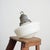 An original opaline glass pendant light. The light has a milk glass opaline shade and original brass hanging gallery. The...