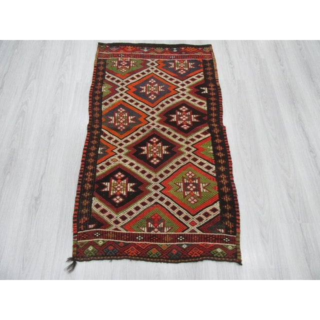 Embroidered vintage small Kilim rug from denizli region of turkey. Approximately 45-55 years old. In good condition