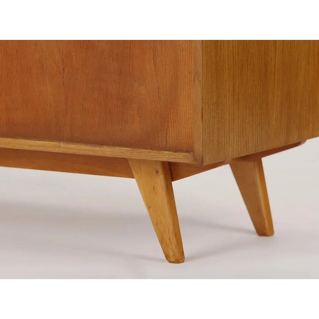 This original Jiri Jiroutek Sideboard was changed stylistically and completely restored by us. This piece has an...