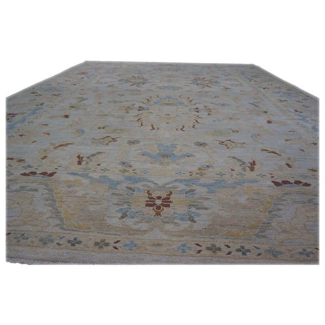 Condition: New Origin: Persia Design: Sultanabad Actual Size: 10'0" x 14'2" Color: Light Blue, Ivory, Tan, Red Content:...