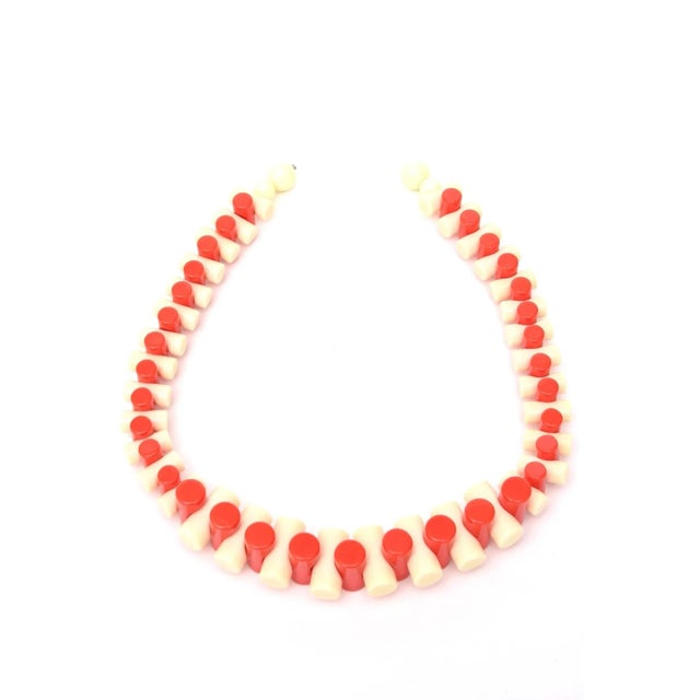 This is part of Chairish’s Costume Jewelry assortment. Alternating colors of orange and creme resin make up this...
