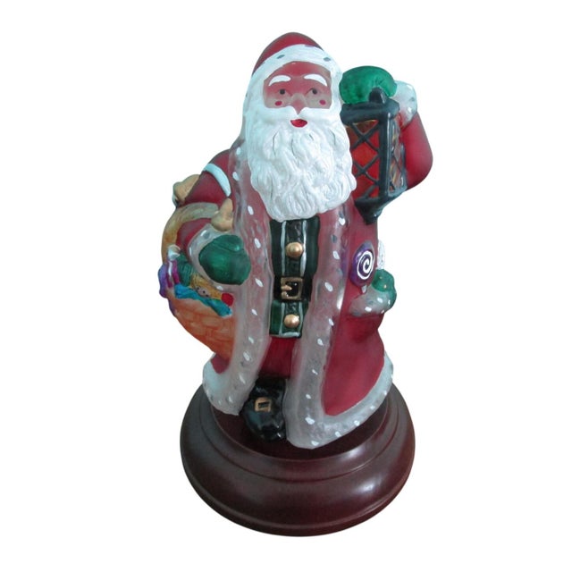 This hand-painted glass Santa lamp celebrates timeless holiday traditions. Retired, 13th edition in an annual series....
