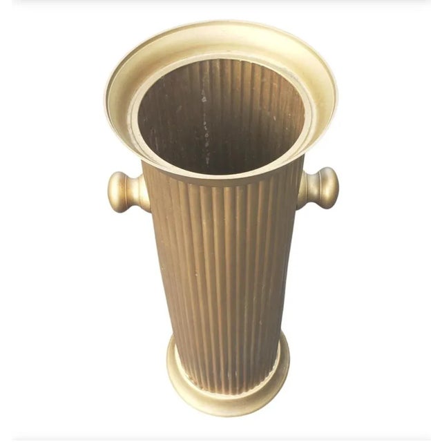 Elegant ribbed brass umbrella stand and Cane holder. Vintage with a modern minimal design makes this the perfect piece for...