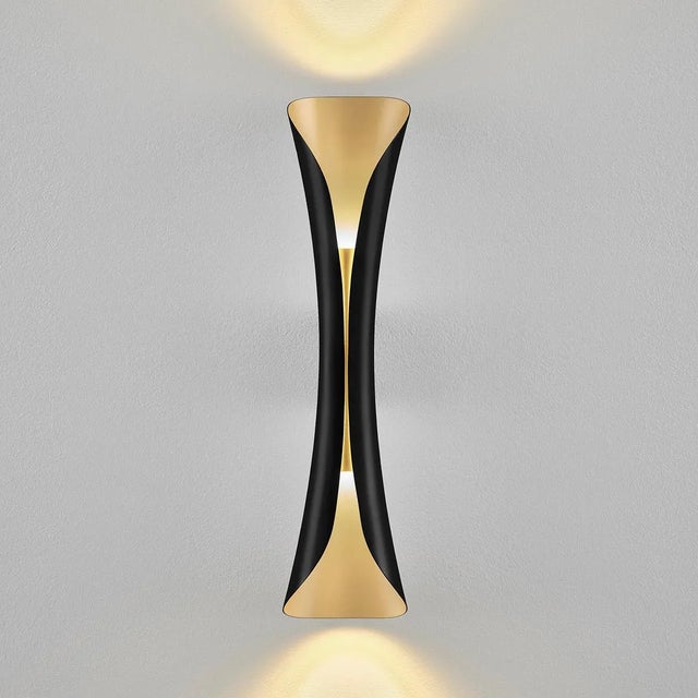 A Curved Sculptured Wall Light Which Emits A Warm Glow Of Up And Down Light Reflected Off The Champagne Gold Interior. Is...