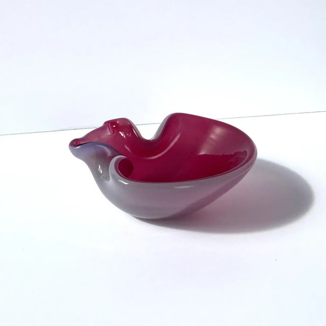 Stunning, unique Venetian glass hand blown vide poche catchall. Beautiful cranberry pink interior with opal exterior,...