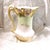 This is an unmarked chocolate pot with great shaping on the top rim and around the bottom with a split handle and gold...