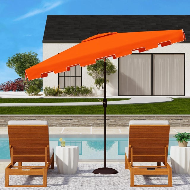 A classic market umbrella gets a stylish makeover in orange and white for chic European flair. Its rectangleangular...