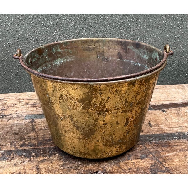 This authentic vintage spun brass bucket is a remarkable example of early 20th-century utilitarian design. Crafted using...