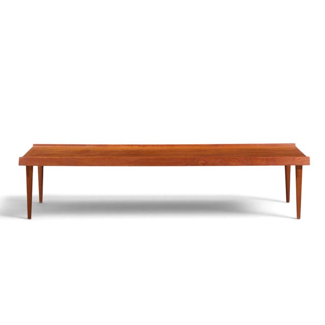 Arne Vodder Style Mid Century Danish Teak Coffee Table This coffee table measures: 71 wide x 23.5 deep x 16 inches high...