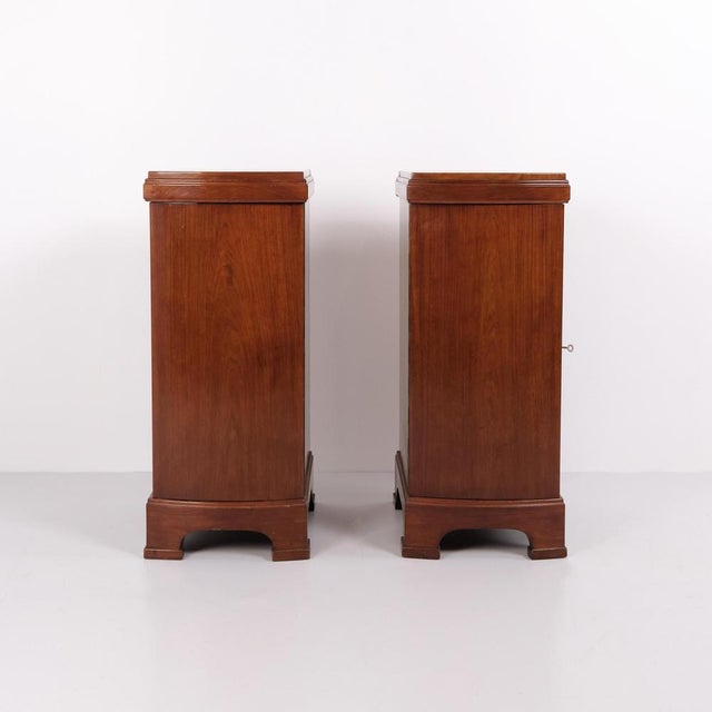 A pair of bedside tables in mahogany from the 1920s with curved front and hand-polished surface. Classic design with an...