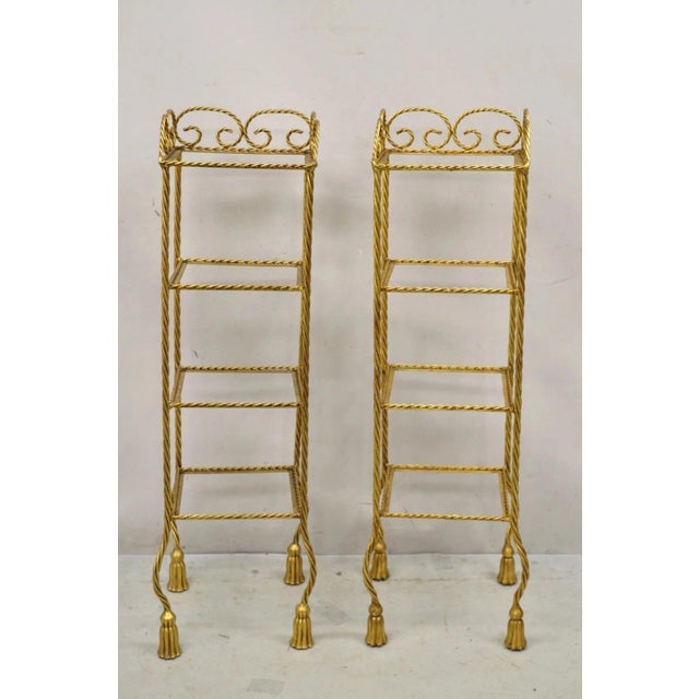 Vintage Italian Hollywood Regency Rope & Tassel Gold 4 Tier Iron Display Rack Etagere Shelf - a Pair. Item features iron...