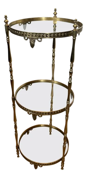 1940s Round brass pedestal table with three glass shelves. French work Attributed to Maison Jansen