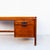 Walnut and rosewood executive desk with sculpted drawer pulls by Jens Risom, made in the US in the 1960s. Similar to...
