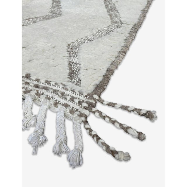 Boujad Rug | Handwoven Berber Wool Rug with Ivory Field and Grey Zigzag Pattern This soft, graphic Boujad rug features a...