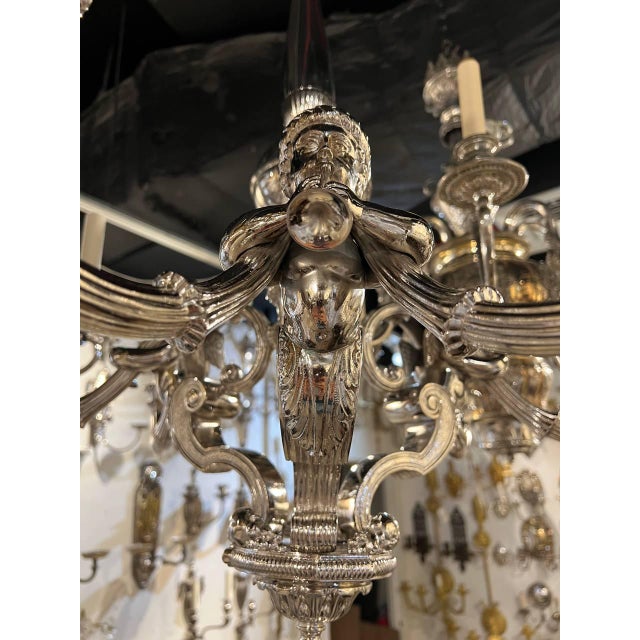 1900 beautiful neoclassical style silver plated chandelier with cherubs holding trumpets. 6 lights