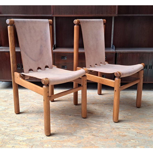 Pair of chairs by Finnish designer Ilmari Tapiovaara, produced by Stilwood in the 1950s. A third chair without upholstery...