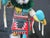 Native Early Morning singer Kachina doll on base, signed Sherman at base. Measures 11" tall x 5.5" x 4.5". Painted wood...