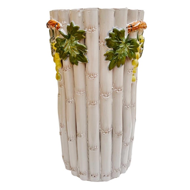 1960s Italian glazed terracotta umbrella stand with a rustic Tuscan design of grapes and faux bamboo stalks. A beautiful...