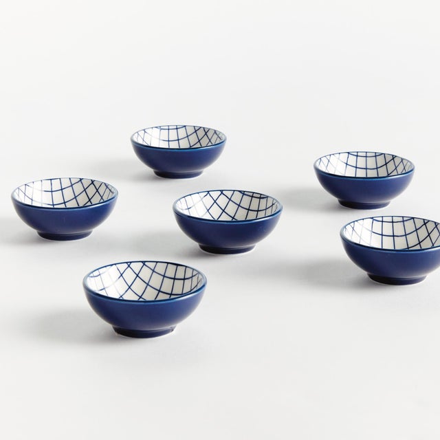 Set the table with a composition in blue. This little stoneware dip bowl set with modern grid design is also perfect for...