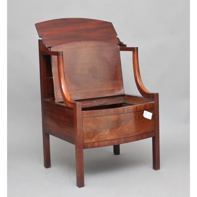 - Early 19th Century mahogany bedside cupboard - Hinged lid with a raised shaped gallery - Curved arm supports leading...