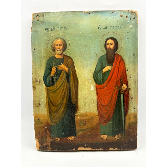 A 19th-century devotional icon of the Apostles Peter and Paul, painted in oil on a wood panel. Pre-revolutionary Cyrillic...