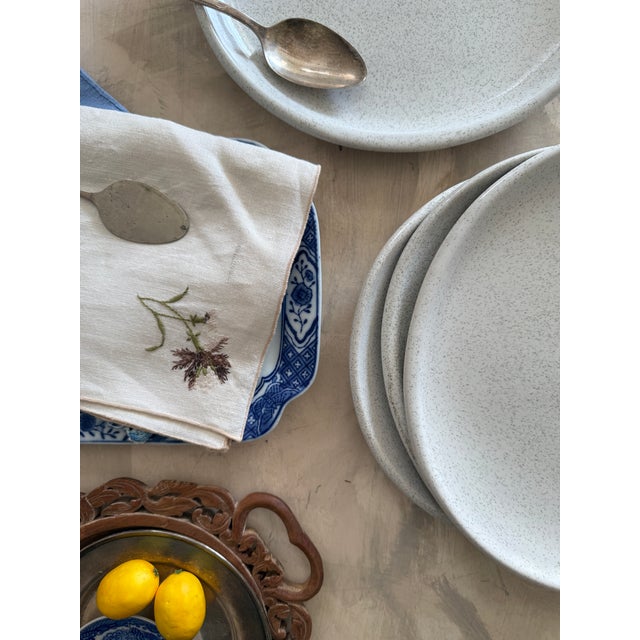 This is a vintage Glidden Pottery asymmetrical dinner plate, set of 4, a striking example of mid-century California studio...