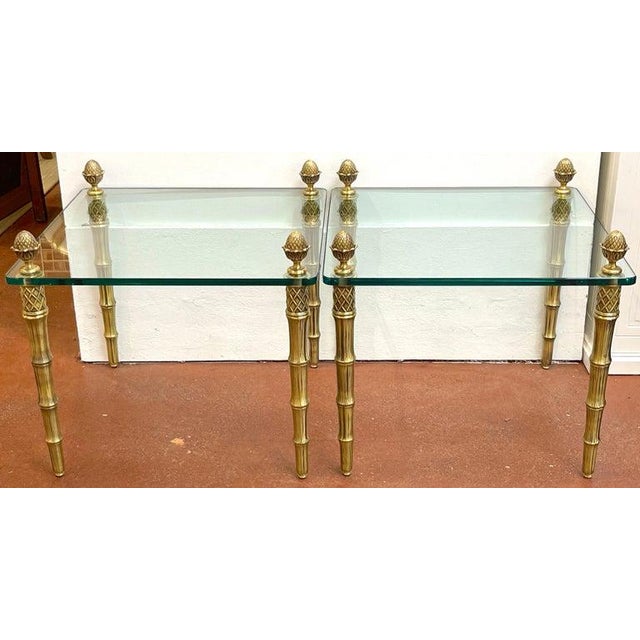 Pair of Maison Jansen Style Gilt Metal Faux Bamboo & Glass Square End Tables France, Circa 1960s A rare pair of Maison...
