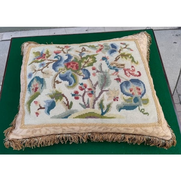Vintage or antique style needlepoint pillow featuring an elaborate floral and bird design, possibly in a Chinoiserie or...