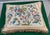 Vintage or antique style needlepoint pillow featuring an elaborate floral and bird design, possibly in a Chinoiserie or...