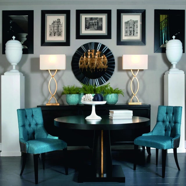 This round dining table with silver or gold leaf detailing has a fixed tabletop. With its strikingly simple pedestal...