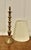 Tall Turned Brass Table Lamp This is a good quality brass piece, it has a single bulbous column set on a Round Footed base...