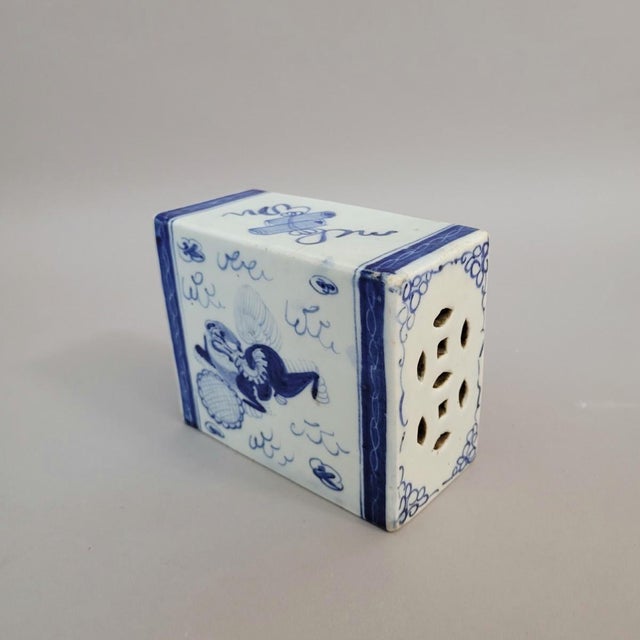 A late Qing dynasty Chinese blue and white porcelain headrest, often called a pillow, was made in a small scholar-scale...