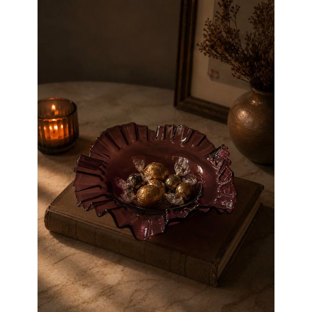 A stunning vintage amethyst plum art glass ruffled bowl in the style most associated with the beloved Fenton Art Glass...
