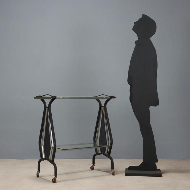 Trolley, enameled metal, glass. Good condition. This piece is attributed to the mentioned designer/maker. It has no...