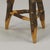 This rustic wooden stool or side table is a beautiful example of folk art from the 1970s. It is made from rough pieces of...