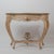 An exceptional 18th century Gustavian-style hand-carved console table, dating to circa 1840. This elegant piece features a...
