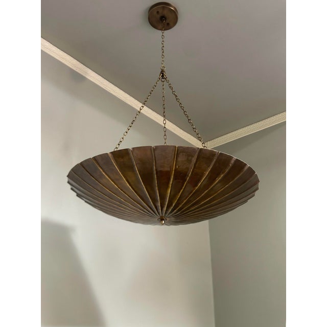 Make a bold statement in your home with this handcrafted brass chandelier pendant light, featuring a stunning scalloped...