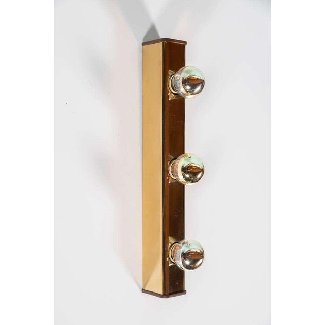 Beautiful identical set of two artist lamps made of gold-colored brass and both equipped with original on/off switch. Made...