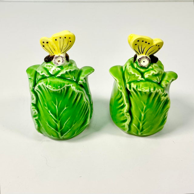 We love this pair of vintage Cabbage/Lettuce Leaf Salt and Pepper Shakers. Each is topped with a yellow butterfly....