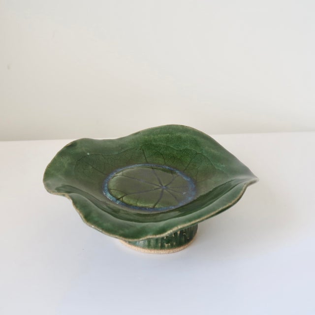 A beautifully handcrafted, signed studio pottery pedestal bowl featuring an organic, freeform silhouette and soft,...