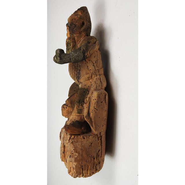 19th century Chinese hand carved wood guardian figure with tiger. Much wear, hand replaced, arm repaired, overall...