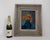 Original oil painting of floral still life featuring orange, yellow, and coral blossoms in a deep green vase against a...