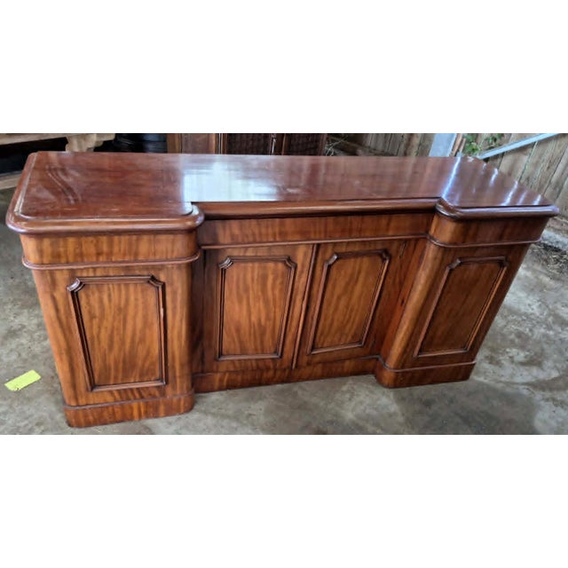Large Mahogany Sideboard – 19th Century This substantial mahogany sideboard features four doors. Made during the first...