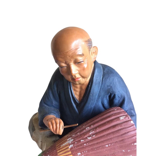 A great vintage Hakata Urasaki Dolls Japanese chalkware elder man villager making an umbrella figurine statue. Please see...