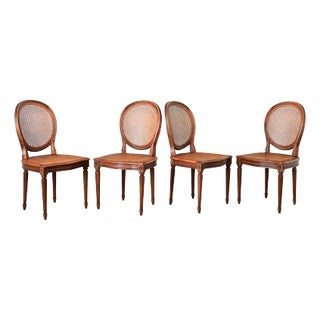 French Vintage Set of Four Louis XVI Style Cane Dining Chairs For Sale