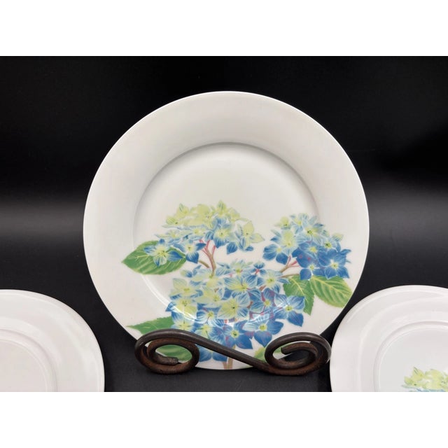 Bring classic English elegance to your table with this **set of 4 Vintage Royal Worcester “Blue Hydrangea” salad plates**....