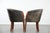 This characterful set of two cowhide tub chairs/side chairs is finished with decorative nails and can easily be placed in...