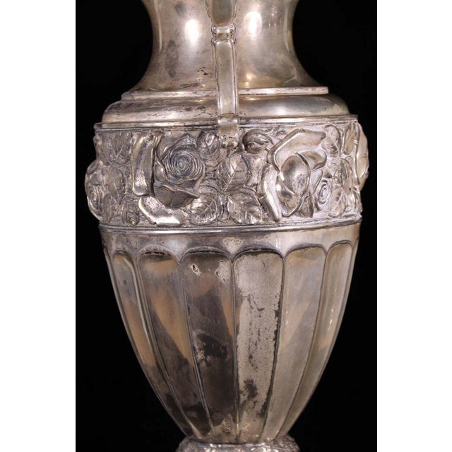 A beautul silver plated brass amphora, suitable for beautiful flower bouquets, it will uplift any living room.